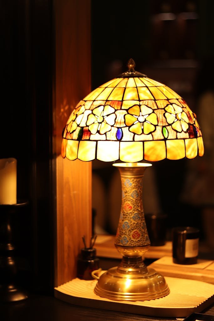 Warm glow from a vintage Tiffany style lampshade, creating an elegant and cozy ambiance.